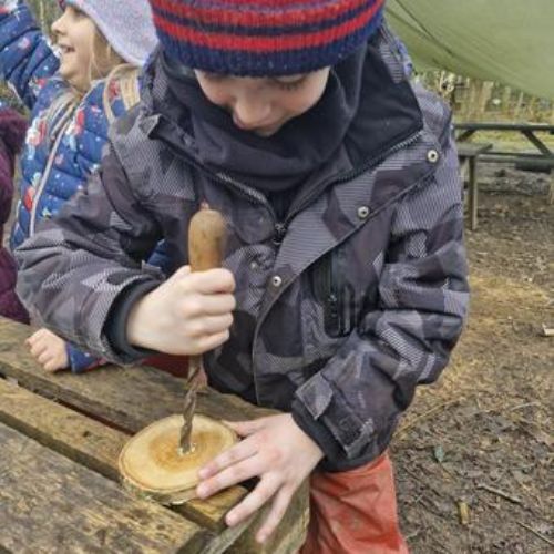 Making spinning tops and decorating them!